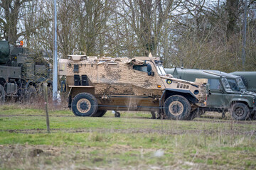 Obraz premium British army Foxhound 4-wheel protected patrol vehicle in desert camouflage, Wiltshire UK