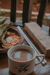 Stock photo and concept of unhealthy eating - close up fast food snacks and cola drink on wooden table