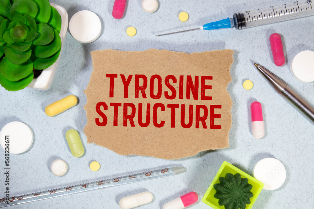 Poster notepad with the text and chemical structure of l tyrosine on table with pills stethoscope.
