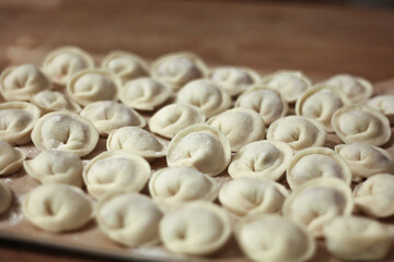 Fresh homemade dumplings handmade lie on the table