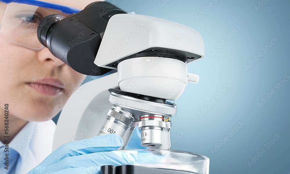 Poster scientist person working with microscope in laboratory.