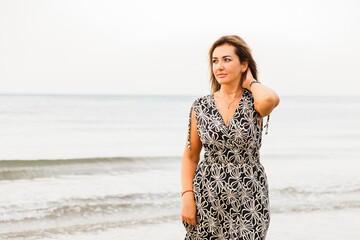 Portrait of a woman on the beach, ocean, unity with nature, healthy lifestyle