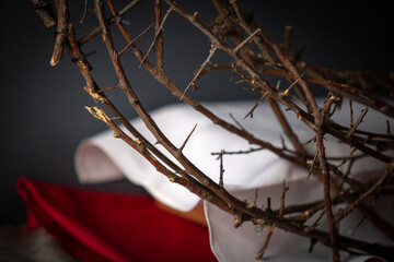 The crown of thorns is a symbol of the suffering of Jesus Christ. With this He was crowned in the day of His suffering. In the Church, this symbol is used on Good Friday before Easter.