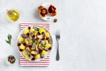 Smoked hering, potato and beetroot salad served with beetroot caviar toasts