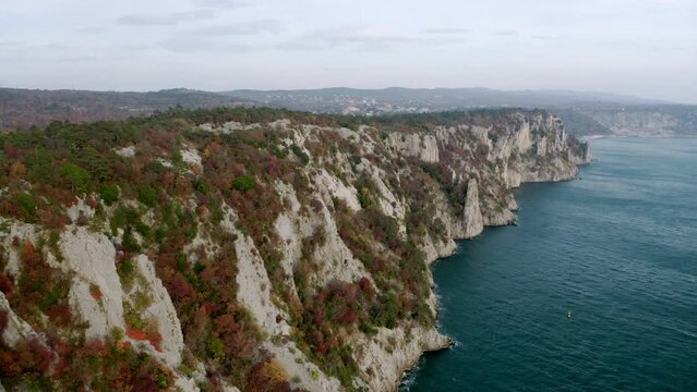 aerial drone shot of sublime cliffs near trieste italy, duino