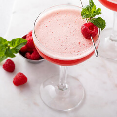 Raspberry martini cocktail with vodka, juice and raspberry liqueur