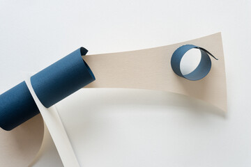 abstract paper forms arranged in a sculptural style on blank paper