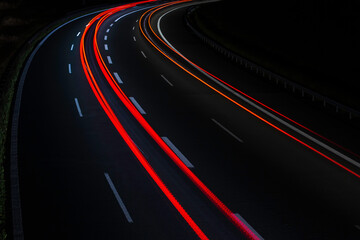 Fototapeta na wymiar light trails from cars on the motorway at night