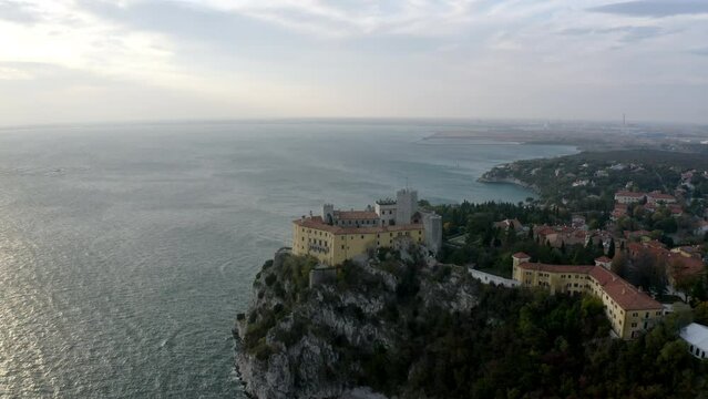 aerial drone shot of duino castle near trieste italy