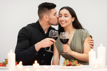 Happily married young couple celebrating valentine day at home