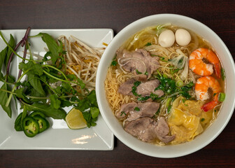Vietnamese soup with egg noodles and beef