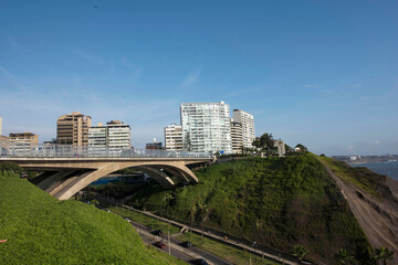Obraz premium The Villena Rey Bridge in Miraflores district in Lima, June 2018- luxury building and ocean pacific Peru. Panoramic view