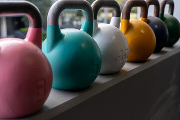 Naklejka na ściany i meble At home gym including kettlebell weights, person getting fit and strong