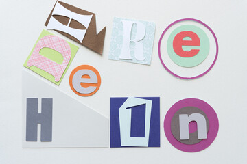 random letters on paper shapes