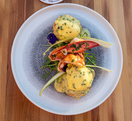 Maine lobster benedict on a white plate