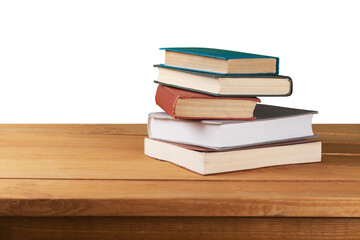 Stack of old books on the wooden deck table