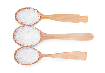 Wooden spoons with natural sea salt isolated on white, top view