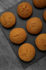 Delicious oatmeal cookies on grey table, top view