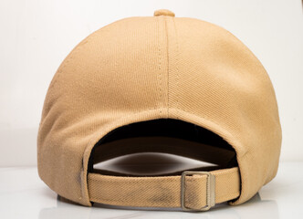 Brown baseball hat on a white background