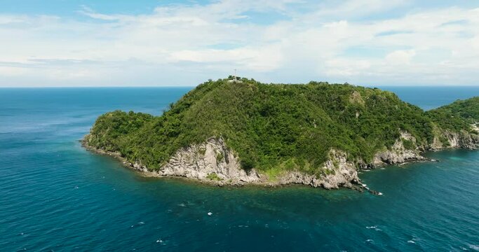 Aerial view of Apo island popular dive site and snorkeling destination with tourists. Negros, Philippines.