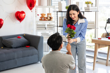 Couple in love hugging in the bedroom with rose and gift Valentine's Day  concept.
