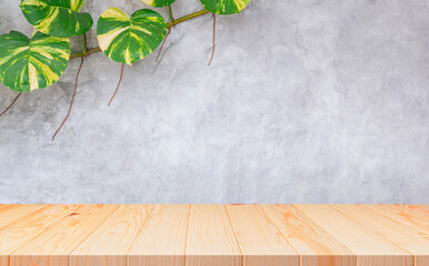 Empty wooden table with creeper plant growing on loft cement Wall Background, suitable for Product...