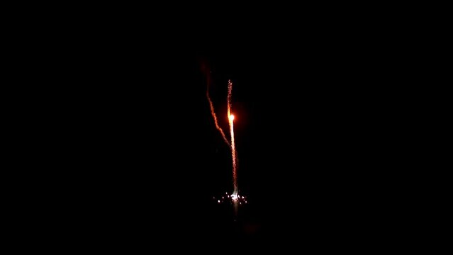 Explosion of bright colorful part of fireworks on black background to create a set salute on video for holiday new year, birthday, wedding or other celebration.