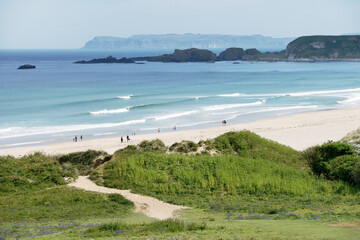 White Park Bay on the Giants Causeway Coast of County Antrim, Northern Ireland. Rathlin Island in distance. Summer.