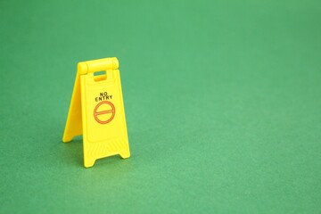 yellow sign with the word no entry. concept cannot enter. not allowed to enter