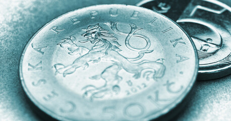 Translation: 50 crowns Czech Republic. Turquoise tinted coin illustration for news about economy or koruna. Czech coins closeup. Crown and Central bank of Czechia. Horizontal stories. Macro