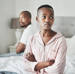 Stress, depression and marriage, black couple on bed in home angry after argument or fight. Mental...
