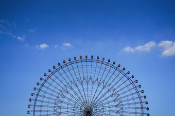 Ferris wheel with blue sky background