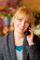 Portrait, woman and phone call for communication, connection and flowers with girl, smile and talking. Face, Canadian female or lady with smartphone, conversation or happiness with beautiful bouquets