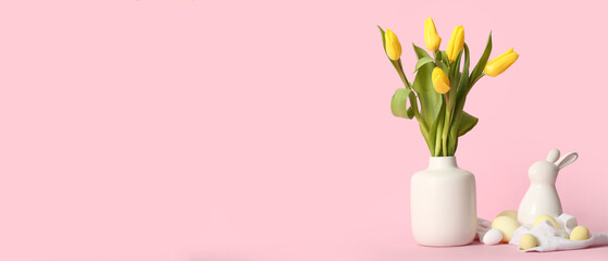Vase with flowers, Easter eggs and toy bunny on pink background with space for text