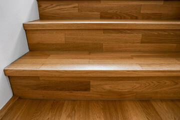 Naklejka na ściany i meble Wooden stairs in modern building, closeup