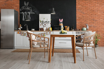 Interior of kitchen with Easter decor, counters and dining table
