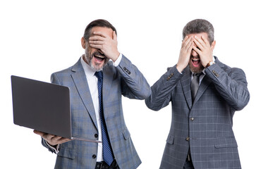 photo of shocked shouting businessmen freelancer with laptop. two businessmen freelancer