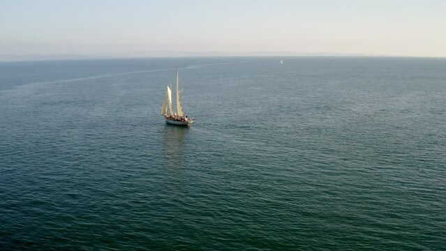 aerial drone shot of sailing boat in trieste gulf