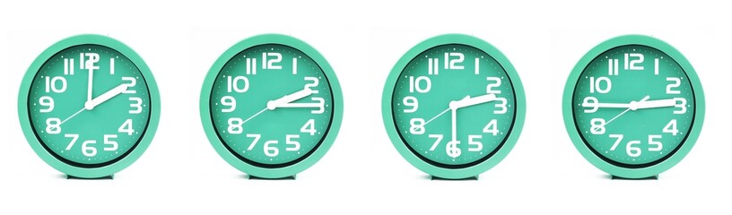 close up of a set of green clocks showing the time; 2, 2.15, 2.30 and 2.45 p.m or a.m. Isolated on white background - obrazy, fototapety, plakaty