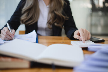 Business woman hands working on calculator, Accountant and finance concept.