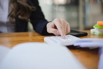 Business woman hands working on calculator, Accountant and finance concept.