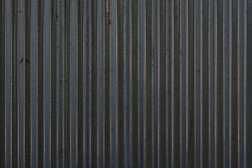 Black corrugated metal sheet background and texture surface