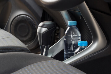 Plastic bottle water  in a car cup holder