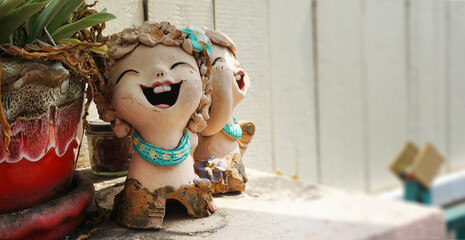 smile ceramic girl doll, countryside garden, vintage nature background, spring summer autumn theme holiday
