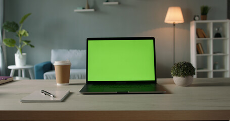 Copy space template - close up shot of modern laptop with chroma key green set up for work in...