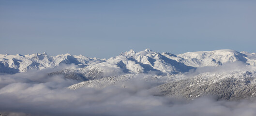 Snow and Cloud covered Canadian Nature Landscape Background. Winter Season in Whistler, British...