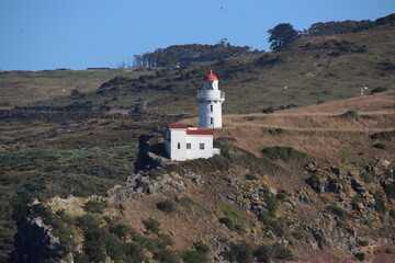 Fototapeta na wymiar Taiaroa Head Lighthouse at the entrance to Otago Harbour on the South Island of New Zealand.
