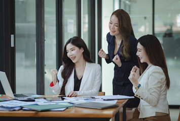 Group of young Asian business woman teamwork and presenting new projects in the office.