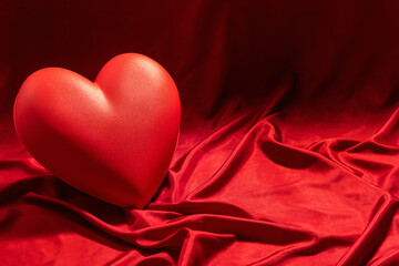 red heart on red satin background, love and Valentines day