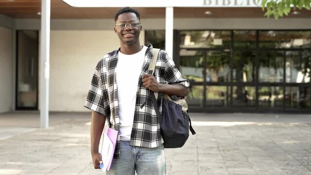 Portrait Of African Male Student Standing In College Building 
